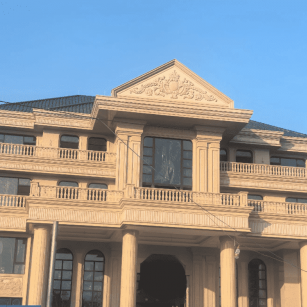 德阳黄金麻别墅外墙干挂石材效果示例